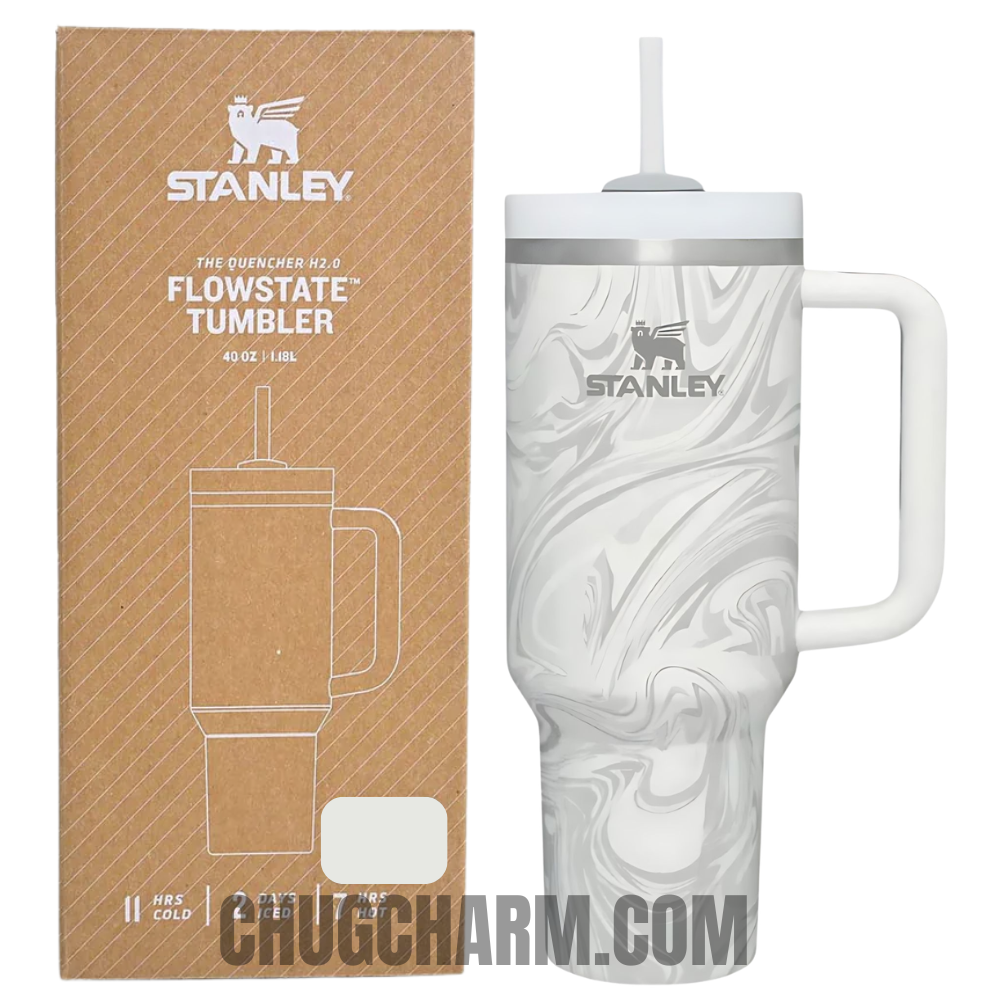 Stanley 40 oz Tumbler in Polar Swirl, designed with a stylish and unique swirl pattern, featuring a sturdy handle and double-wall insulation for excellent temperature retention, ideal for keeping drinks hot or cold.