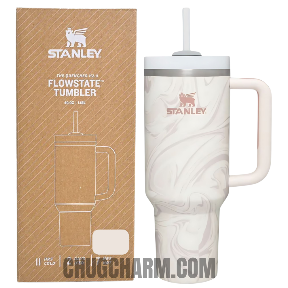 Stanley 40 oz Tumbler in Rose Quartz Swirl with a stylish swirl pattern, ergonomic handle, and double-wall insulation for keeping drinks hot or cold