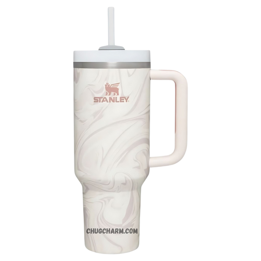Stanley 40 oz Tumbler in Rose Quartz Swirl with a stylish swirl pattern, ergonomic handle, and double-wall insulation for keeping drinks hot or cold