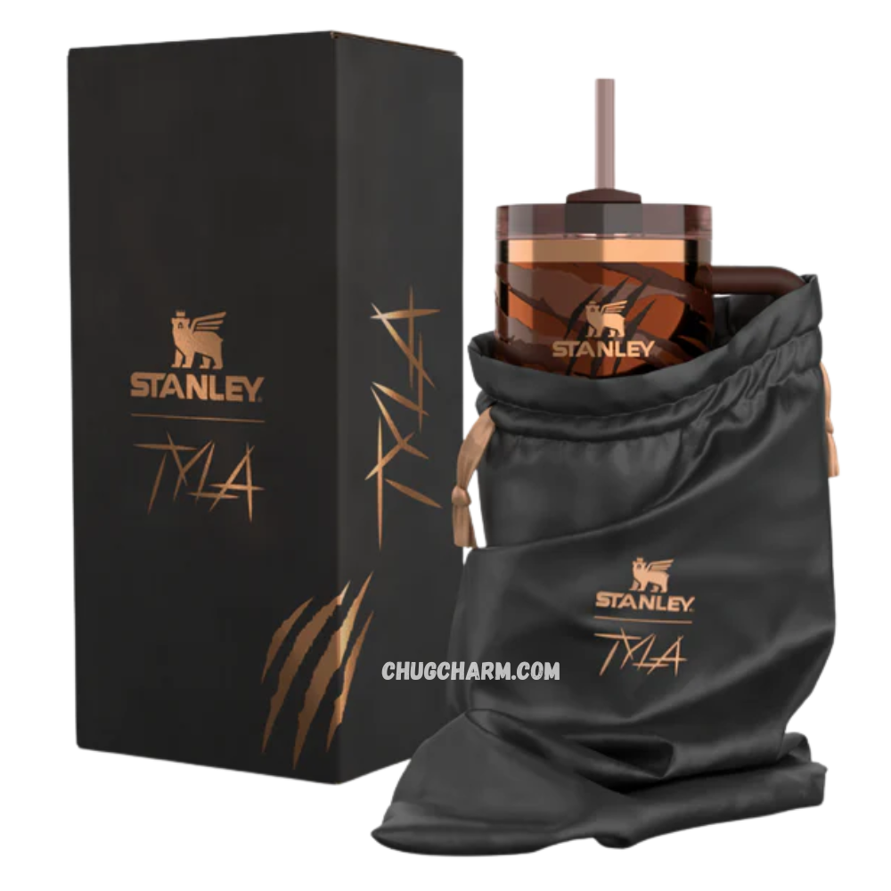 Stanley Tyla Tyger Tumbler 40 OZ placed in a car cup holder, showing cup holder compatibility and portability.