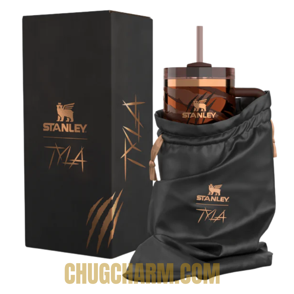 Stanley Tyla Tyger Tumbler 40 OZ placed in a car cup holder, showing cup holder compatibility and portability.