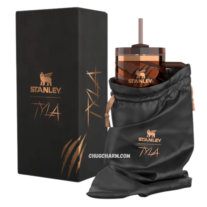 Stanley Tyla Tyger Tumbler 40 OZ placed in a car cup holder, showing cup holder compatibility and portability.